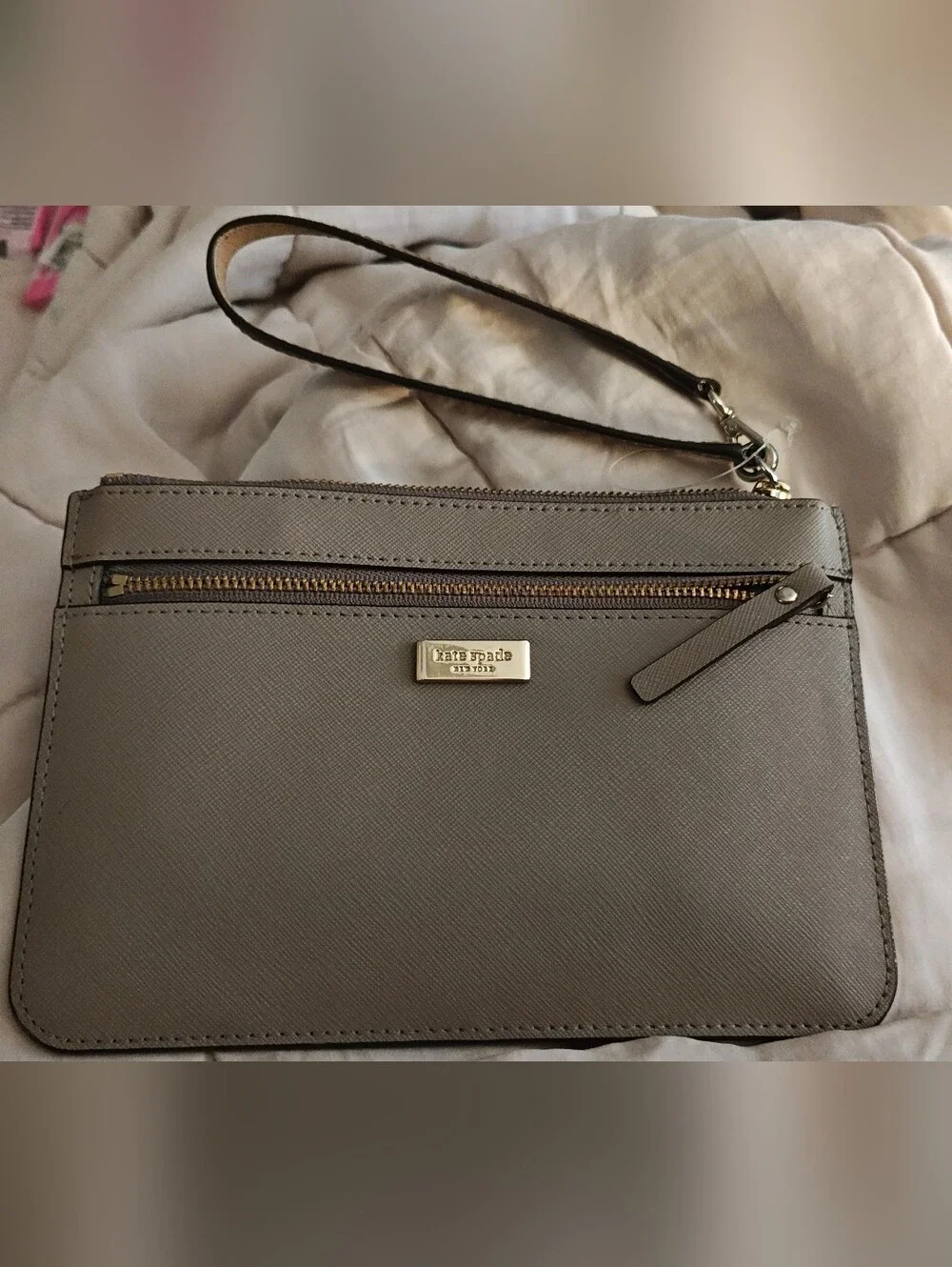 kate Spade taupe saffiano wristlet with gold hardware